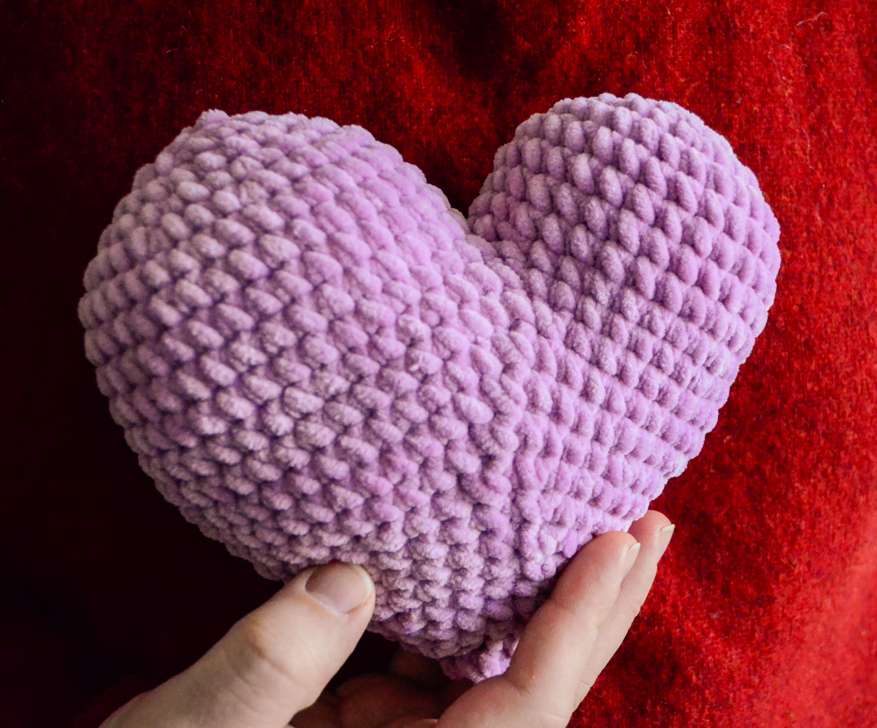 Free amigurumi heart pattern - Patchy heart sample held in a hand