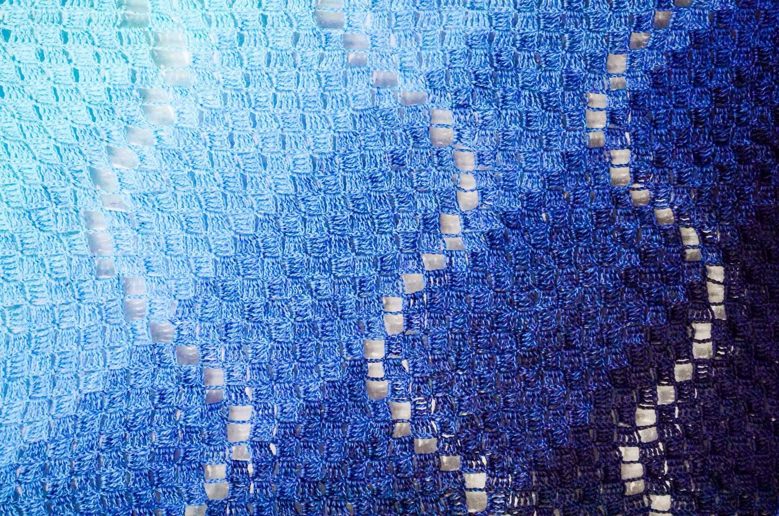 blue crochet blanket with waves